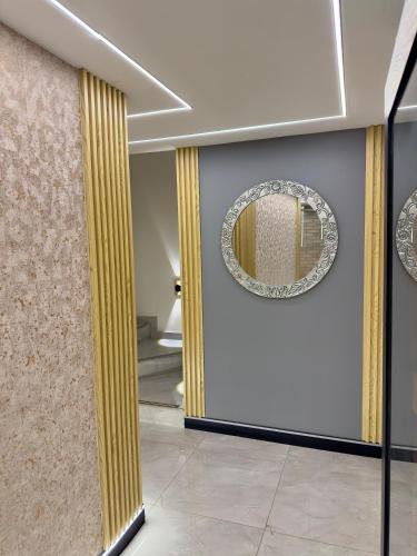 a hallway with a door with a mirror on it at Hotel En Chia BIBA LIFE in Chía