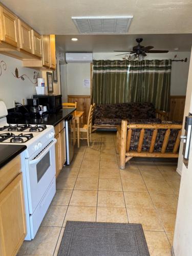 a kitchen with a stove and a counter top at Fireside Lodge in Big Bear Lake