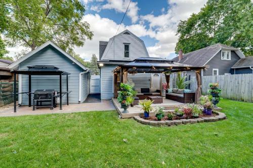 a backyard with a pergola and a house at 1 Mi to Dtwn Elgin Dutch Colonial with Lovely Patio in Elgin