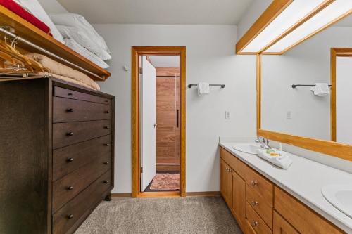 a bathroom with a sink and a mirror at Quicksilver 1645 by Summit County Mountain Retreats in Keystone
