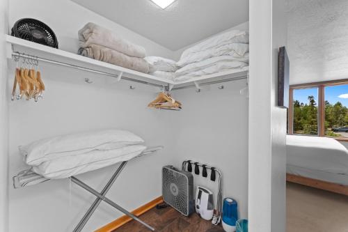 a room with two bunk beds and a window at Lodgepole 2003 by Summit County Mountain Retreats in Keystone