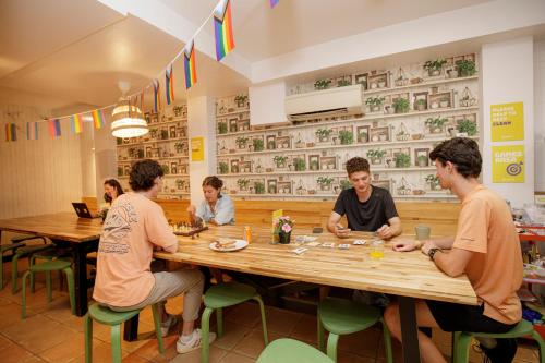 a group of people sitting around a table in a restaurant at Onefam Batlló in Barcelona