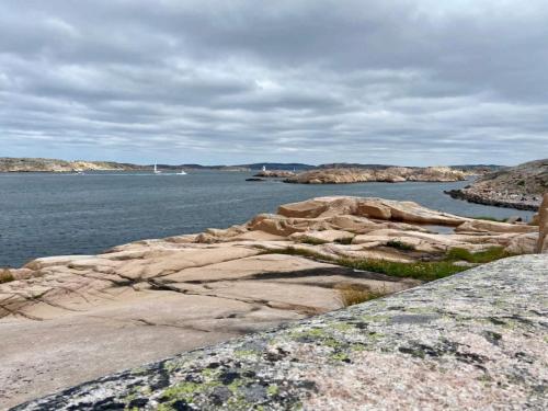 a view of a body of water with rocks at 4 star holiday home in Hamburgsund in Hamburgsund