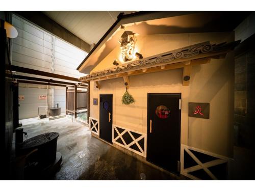 a building with a door in the side of it at Kisuke no yado - Vacation STAY 91620v in Matsuyama