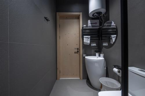 a bathroom with a toilet with a camera on top of it at 5 Star Duluxe Apartment in Villa Magnetica in Ozurgetʼi