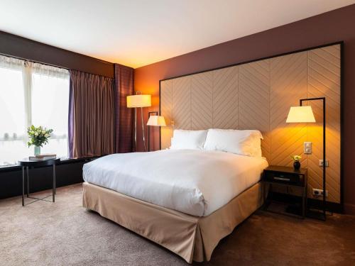Un ou plusieurs lits dans un hébergement de l'établissement Sofitel Strasbourg Grande Ile