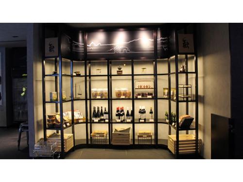 a display case filled with lots of bottles of wine at Skye Niseko - Vacation STAY 70602v in Niseko
