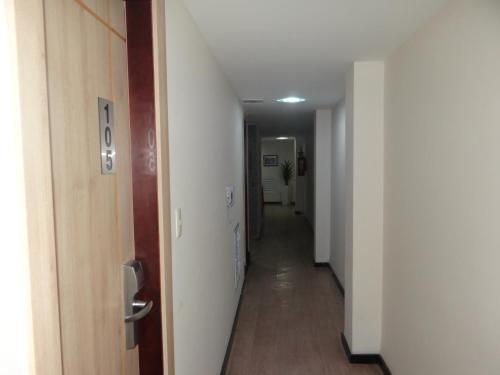a hallway of an apartment with a long corridor at Hotel Meu Cantinho (Adults Only) in Rio de Janeiro