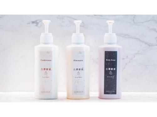 three bottles of shampoo and conditioners sitting on a shelf at Skye Niseko - Vacation STAY 70597v in Niseko