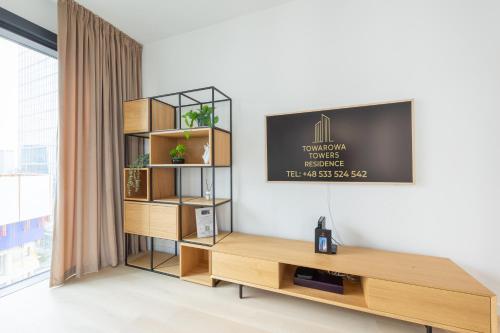 TV a/nebo společenská místnost v ubytování Towarowa Towers Residences