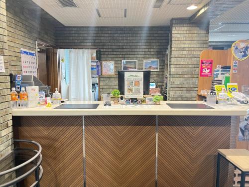 a counter in a store with two sinks at Hotel Tetora Hachinohe - Vacation STAY 12756v in Hitoichi