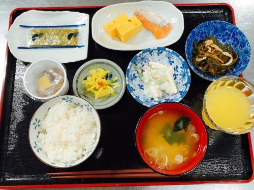 a tray of food with rice and bowls of food at Hotel Tetora Hachinohe - Vacation STAY 12756v in Hitoichi