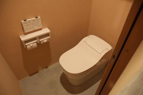 a bathroom with a white toilet in a room at 2-times,Dormitory Hotel - Vacation STAY 55487v in Itoshima