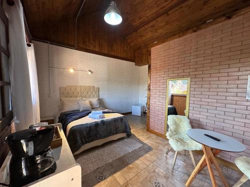 Een bed of bedden in een kamer bij Flat Girassol Santo Antônio do Pinhal