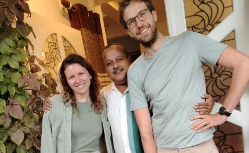 two men and a woman posing for a picture at Kandy Home stay in Katugastota