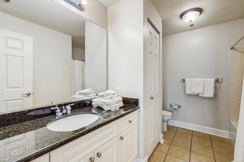 a bathroom with a sink and a toilet at Seawind 1503 in Gulf Shores
