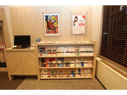 a room with a pharmacyacist with a shelf with medicines at Smile Hotel Aomori - Vacation STAY 75478v in Aomori