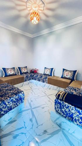 a room with two beds and a glass floor at Chez Mazgiti in Ourika
