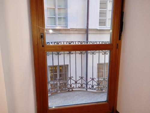 a window with a view of a balcony at Pretty twin Palatina Centro Torino in Turin