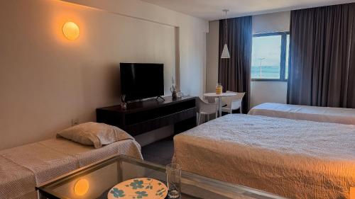 Ένα ή περισσότερα κρεβάτια σε δωμάτιο στο Ritz Suítes 215 Beira-Mar - Hosti