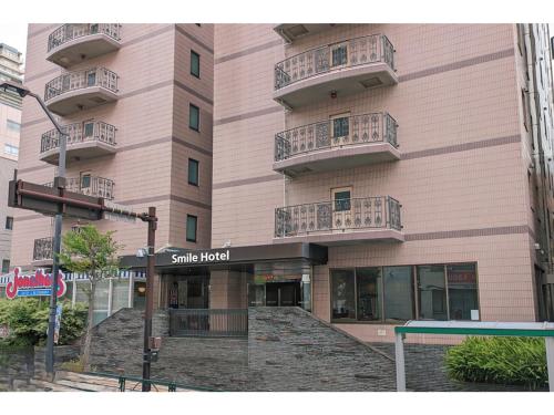 a building with balconies on the side of it at Smile Hotel Tokyo Shinkoiwa - Vacation STAY 33628v in Tokyo