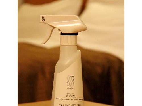 a white electric toothbrush sitting on top of a table at Smile Hotel Tokyo Shinkoiwa - Vacation STAY 82160v in Tokyo