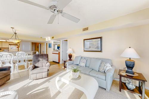 a living room with a couch and a table at Wind Drift 512S in Perdido Key