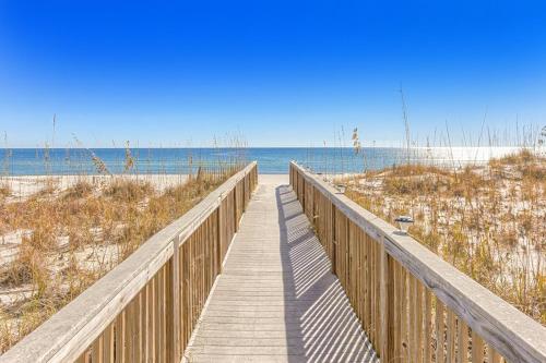 a wooden boardwalk leading to a beach with the ocean at Wind Drift 512S in Perdido Key