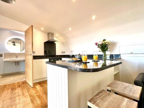 a kitchen with a large island in a room at 1 Bed in Bude 88499 in Morwenstow