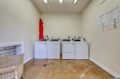 a laundry room with white washers and dryers at Village of South Walton EB212 in Rosemary Beach