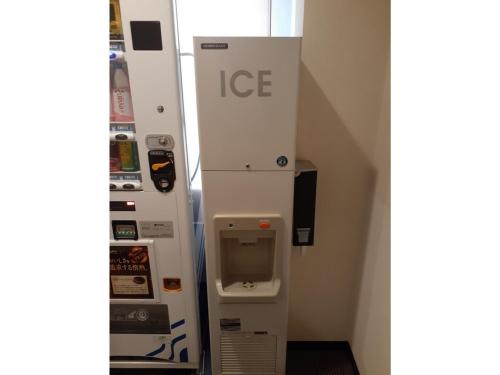 an ice machine in a room next to a wall at Smile Hotel Sakurambo Higashine - Vacation STAY 30008v in Higashine