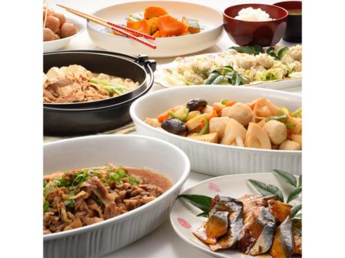 a table topped with bowls of different types of food at Smile Hotel Sakurambo Higashine - Vacation STAY 30008v in Higashine