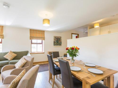 a dining room with a table and chairs at 1 Bed in Cairnbaan CA304 in Lochgilphead
