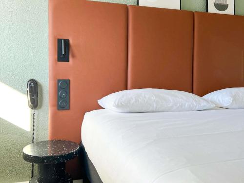 Postel nebo postele na pokoji v ubytování ibis Nîmes Ouest - A9