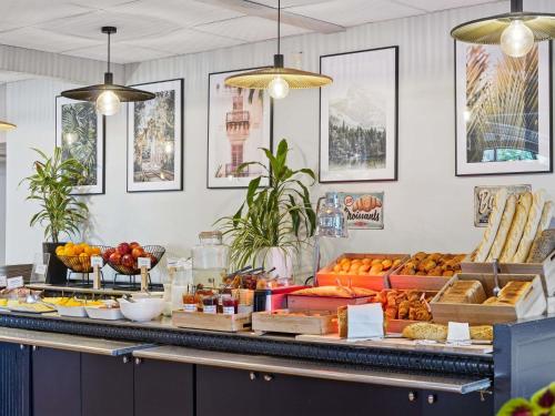 a buffet with many different types of food on display at ibis Paris Porte D'Orleans in Montrouge