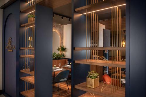a room with wooden shelves and a table at NH Collection Roma Centro in Rome