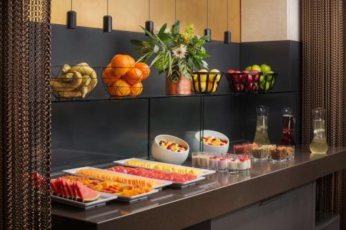 a buffet with different types of food on a table at NH Collection Roma Centro in Rome