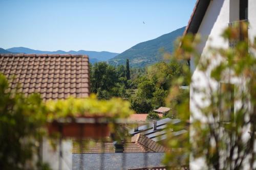 a view of the mountains from the balcony of a house at Casa Maza Apartamentos in Biescas