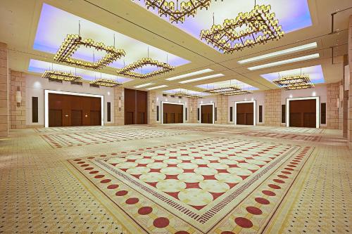 an empty ballroom with a large room with chandeliers at The Westin Resort, Costa Navarino in Romanós