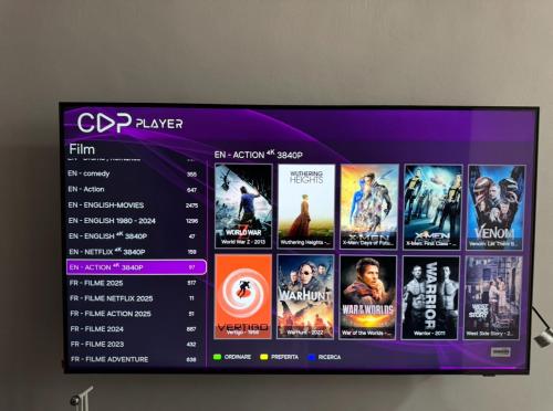 a tv screen with a bunch of movies on it at Apartment Camilla in Martil