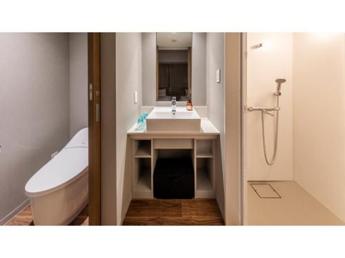 a bathroom with a sink and a toilet and a tub at Far East Village Hotel Tokyo Ariake - Vacation STAY 31683v in Tokyo