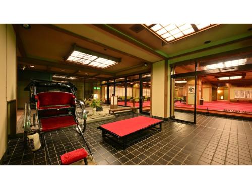 a room with a red carriage in a building at Osakaya Ryokan - Vacation STAY 30202v in Kusatsu