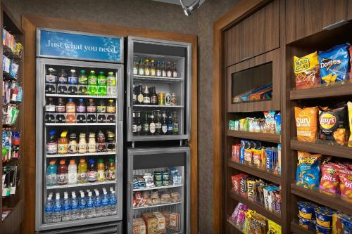 a refrigerator filled with lots of drinks in a store at Fairfield Inn & Suites by Marriott Fayetteville North in Fayetteville