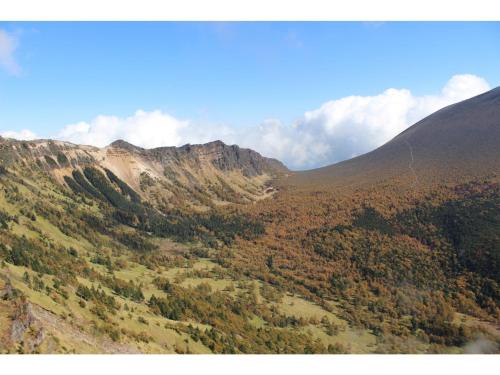 an aerial view of a mountain with trees on it at Takamine Kogen Hotel - Vacation STAY 36239v in Shin-kazawa