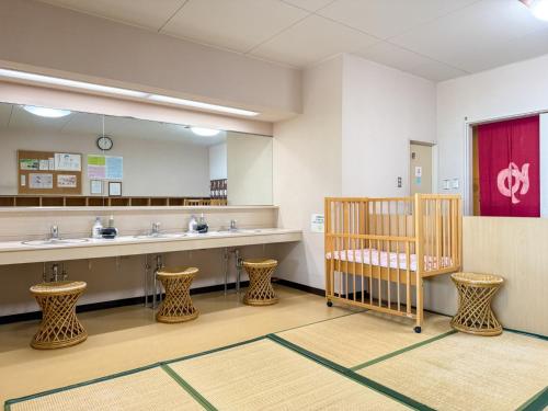 a waiting room with two sinks and a mirror at Takamine Kogen Hotel - Vacation STAY 36239v in Shin-kazawa