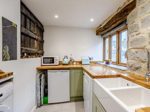 a kitchen with a sink and a counter top at 1 Bed in Glastonbury 79123 in Glastonbury