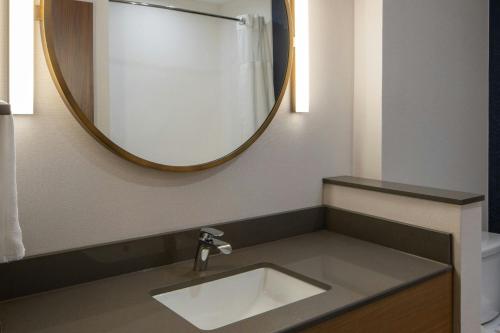 a bathroom with a sink and a mirror at Fairfield Inn & Suites by Marriott Foley in Foley