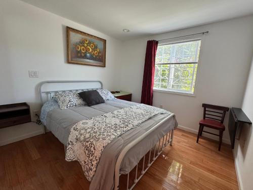 a bedroom with a bed and a window at San Francisco 2 Bedroom with Parking near BART in San Francisco