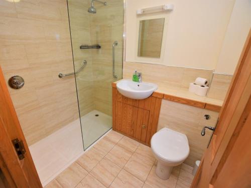 a bathroom with a shower and a toilet and a sink at 2 bed property in Cairnbaan CA113 in Cairnbaan