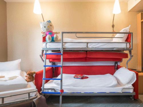 a group of bunk beds in a room at Hotel ibis Narbonne in Narbonne
